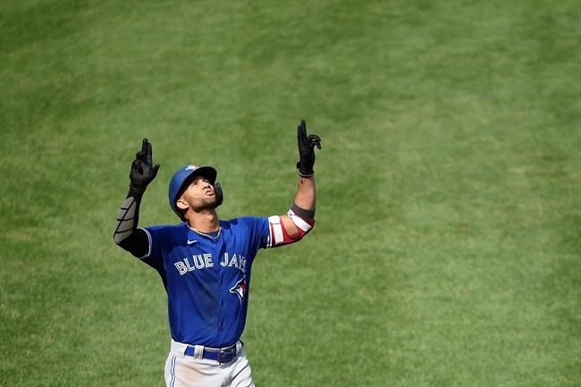 Toronto Blue Jays' Lourdes Gurriel Jr. reacts after hitting his second home run against the Baltimore Orioles, this one in the fifth inning of a baseball game, Sunday, Sept. 12, 2021, in Baltimore. (AP Photo/Gail Burton)