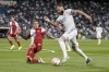 Real Madrid's Karim Benzema, right, vies for the ball during the Spanish La Liga soccer match between Real Madrid and Celta de Vigo at the Bernabeu stadium in Madrid, Spain, Sunday, Sept. 12, 2021. (AP Photo/Manu Fernandez)
