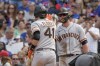 San Francisco Giants' Wilmer Flores, left, celebrates his two-run home run with Kris Bryant, right, during the fifth inning of a baseball game against the Chicago Cubs, Sunday, Sept. 12, 2021, in Chicago. (AP Photo/Mark Black)