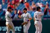 Colorado Rockies' Brendan Rodgers, from left, Garrett Hampson and Colton Welker celebrate after a baseball game against the Philadelphia Phillies, Sunday, Sept. 12, 2021, in Philadelphia. (AP Photo/Matt Slocum)