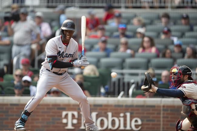 Miami Marlins Jesus Sanchez (76) scream was he takes a strike in the ninth inning of a baseball game against the Atlanta Braves Sunday, Sept. 12, 2021, in Atlanta. (AP Photo/Hakim Wright Sr)