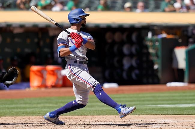 Texas Rangers' Leody Taveras hits an RBI-triple against the Oakland Athletics during the fourth inning of a baseball game in Oakland, Calif., Sunday, Sept. 12, 2021. (AP Photo/Jeff Chiu)