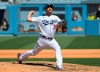 Los Angeles Dodgers Max Scherzer pitches his 3000th career strikeout with this throw against San Diego Padres first baseman Eric Hosmer in the fifth inning during in a baseball game Sunday, Sept. 12, 2021, in Los Angeles, Calif. (AP Photo/John McCoy)