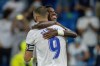 Real Madrid's Karim Benzema celebrates with his teammate Real Madrid's Vinicius Junior after scoring a penalty kick during the Spanish La Liga soccer match between Real Madrid and Celta de Vigo at the Bernabeu stadium in Madrid, Spain, Sunday, Sept. 12, 2021. (AP Photo/Manu Fernandez)
