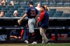 ADDS NAME OF HEAD ATHLETIC TRAINER MICHAEL SALAZAR - Minnesota Twins pitcher John Gant (33) walks off the field with Twins head athletic trainer Michael Salazar after being taken out of a baseball game against the New York Yankees during the first inning Monday, Sept. 13, 2021, in New York. (AP Photo/Adam Hunger)