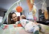 Amanda Elkington, 29, at home with her three-month old, Wren in Cayuga, Ont., Monday, Sept. 13, 2021. Elkington has been fighting for her full employment benefits while on maternity leave after her workplace was closed due to COVID-19. THE CANADIAN PRESS/Peter Power
