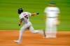 Houston Astros' Jose Siri (26) celebrates his solo home run as he rounds the bases past Texas Rangers first baseman Nathaniel Lowe in the eighth inning of a baseball game in Arlington, Texas, Monday, Sept. 13, 2021. (AP Photo/Tony Gutierrez)