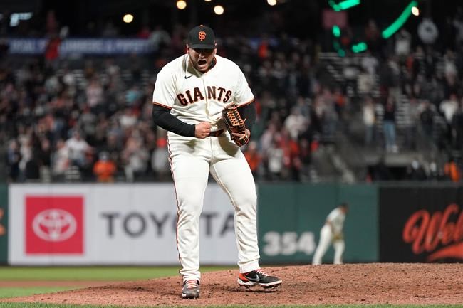 San Francisco Giants pitcher Kervin Castro celebrates after the Giants defeated the San Diego Padres in a baseball game to clinch a postseason berth in San Francisco, Monday, Sept. 13, 2021. (AP Photo/Jeff Chiu)