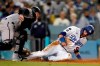 Los Angeles Dodgers' Gavin Lux, right, is tagged out at home plate by Arizona Diamondbacks catcher Carson Kelly after a sacrifice fly by Mookie Betts during the fourth inning of a baseball game Monday, Sept. 13, 2021, in Los Angeles. (AP Photo/Marcio Jose Sanchez)
