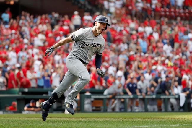 FILE - In this Sept. 15, 2019, file photo, Milwaukee Brewers' Ryan Braun celebrates after hitting a grand slam during the ninth inning of a baseball game against the St. Louis Cardinals in St. Louis. Braun, the Brewers' home run leader whose production was slowed by injuries during the second half of his 14-year career, announced his retirement on Tuesday, Sept. 14, 2021. Braun hasn’t played all season and said during spring training that he was leaning toward retirement. (AP Photo/Jeff Roberson, File)