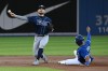 Tampa Bay Rays' Brandon Lowe, left, forces out Toronto Blue Jays' Marcus Semien at second base and throws to to first base to complete a double play on a ball hit by Blue Jays' Vladimir Guerrero Jr. in the first inning of an American League baseball game in Toronto on Tuesday, Sept. 14, 2021. THE CANADIAN PRESS/Jon Blacker