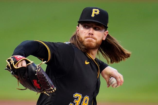 Pittsburgh Pirates starting pitcher Dillon Peters delivers during the first inning of a baseball game against the Cincinnati Reds in Pittsburgh, Tuesday, Sept. 14, 2021. (AP Photo/Gene J. Puskar)
