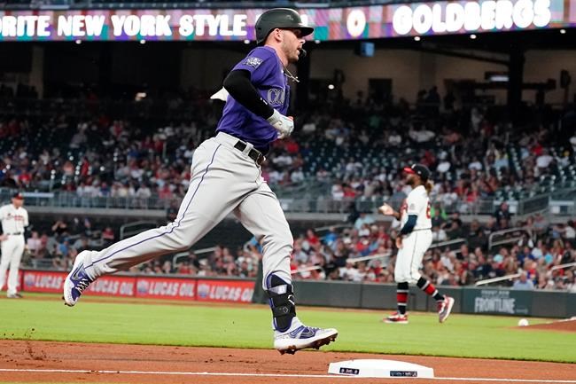 Colorado Rockies shortstop Trevor Story (27) rounds the bases after hitting a solo home run in the first inning of a baseball game against the Atlanta Braves Tuesday, Sept. 14, 2021, in Atlanta. (AP Photo/John Bazemore)