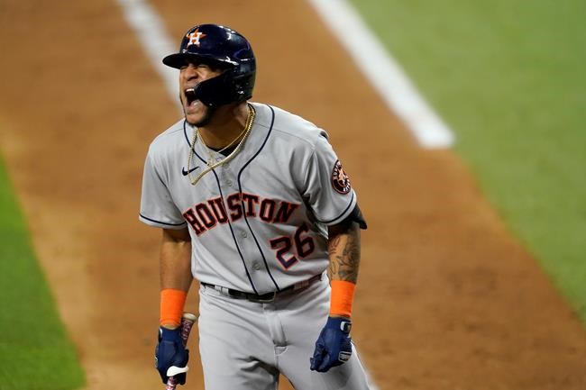 Houston Astros' Jose Siri shouts after on the left hand by a pitch from Texas Rangers' Jordan Lyles during the fifth inning of a baseball game in Arlington, Texas, Tuesday, Sept. 14, 2021. Siri stayed in the game. (AP Photo/Tony Gutierrez)