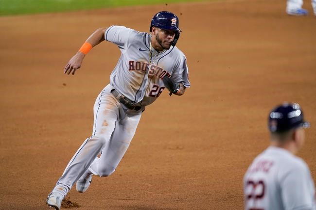 Houston Astros' Jose Siri advances to third on a wild pitch during the fifth inning of the team's baseball game against the Texas Rangers in Arlington, Texas, Tuesday, Sept. 14, 2021. (AP Photo/Tony Gutierrez)