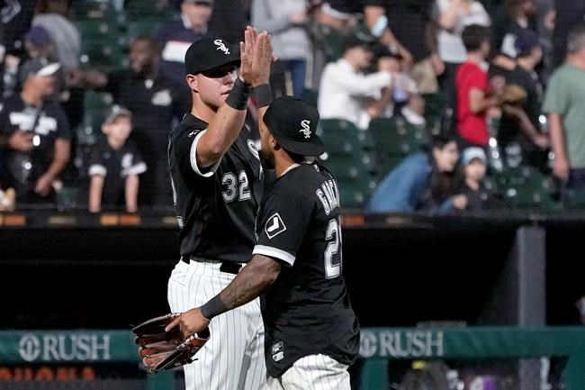 Chicago White Sox's Gavin Sheets (32) and Leury Garcia celebrate the team's 9-3 win over the Los Angeles Angels in a baseball game Tuesday, Sept. 14, 2021, in Chicago. (AP Photo/Charles Rex Arbogast)
