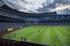 Kansas City Royals starting pitcher Jackson Kowar, lower right, warms up in the outfield before the start of their baseball game against the Oakland Athletics, Tuesday, Sept. 14, 2021 in Kansas City, Mo. The Royals announced today that they're exploring the possibility of a new baseball stadium in downtown Kansas City, Mo. (AP Photo/Reed Hoffmann)