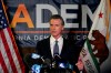 California Gov. Gavin Newsom addresses reporters after beating back the recall attempt that aimed to remove him from office, at the John L. Burton California Democratic Party headquarters in Sacramento, Calif., Tuesday, Sept. 14, 2021. (AP Photo/Rich Pedroncelli)