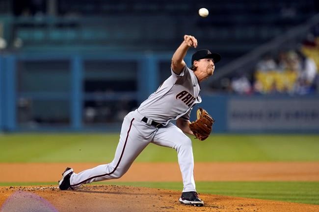 Arizona Diamondbacks starting pitcher Luke Weaver throws to a Los Angeles Dodgers batter during the first inning of a baseball game Tuesday, Sept. 14, 2021, in Los Angeles. (AP Photo/Marcio Jose Sanchez)