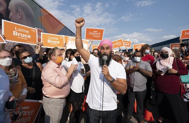 NDP Leader Jagmeet Singh greets supporters during a campaign stop in Kitchener, Ont., Tuesday, Sept. 14, 2021. Two NDP candidates have resigned after comments on social media caused backlash. THE CANADIAN PRESS/Jonathan Hayward