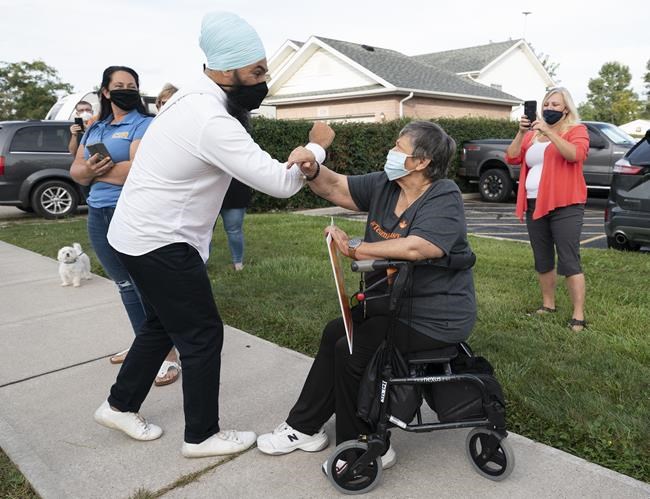 NDP leader Jagmeet Singh greets supporters as he arrives for a morning announcement in Essex, Ontario on Wednesday, September 15, 2021. THE CANADIAN PRESS/Jonathan Hayward