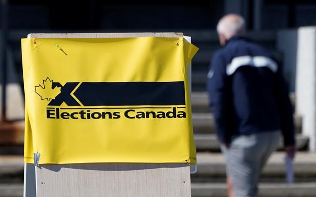 A man enters an advance polling station in Ottawa, Friday, Sept. 10, 2021. Political strategists say campaigns must pull out all the stops to get supporters to cast their ballots on Monday if they hope to pull ahead and win this pandemic election. THE CANADIAN PRESS/Adrian Wyld