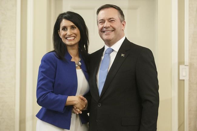 Alberta premier Jason Kenney shakes hands with Leela Aheer, Minister of Culture, Multiculturalism and Status of Women, after being sworn into office, in Edmonton on April 30, 2019. Aheer is calling on the premier to admit he botched the fourth wave of COVID-19 and to outline a plan to fix it. THE CANADIAN PRESS/Jason Franson
