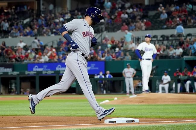 Houston Astros' Marwin Gonzalez rounds the bases after hitting a solo home run off of Texas Rangers starting pitcher Kohei Arihara, rear, in the second inning of a baseball game in Arlington, Texas, Wednesday, Sept. 15, 2021. (AP Photo/Tony Gutierrez)