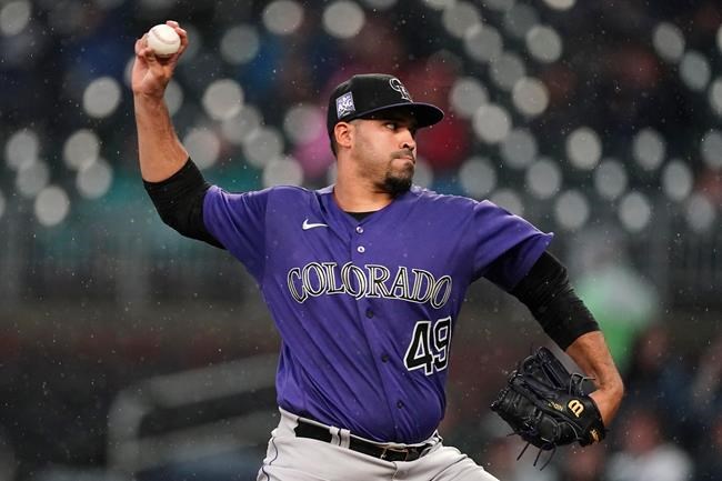 Colorado Rockies starting pitcher Antonio Senzatela works in the first inning of the team's baseball game against the Atlanta Braves on Wednesday, Sept. 15, 2021, in Atlanta. (AP Photo/John Bazemore)