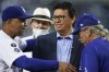 Former Los Angeles Dodgers pitcher Fernando Valenzuela, center, greets Dodgers manager Dave Roberts, left, during a ceremony honoring Valenzuela before a baseball game between the Arizona Diamondbacks and the Los Angeles Dodgers Wednesday, Sept. 15, 2021, in Los Angeles. (AP Photo/Ashley Landis)