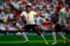 England's Reece James and Jordan Henderson, right, control the ball during the World Cup 2022 group I qualifying soccer match between England and Andorra at Wembley stadium in London, Sunday, Sept. 5, 2021. (AP Photo/Ian Walton)
