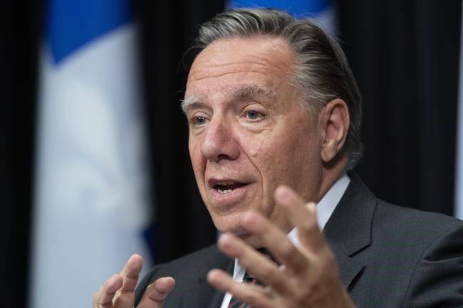 Quebec Premier François Legault responds to reporters questions before question period Wednesday, Sept. 15, 2021, at the legislature in Quebec City. THE CANADIAN PRESS/Jacques Boissinot