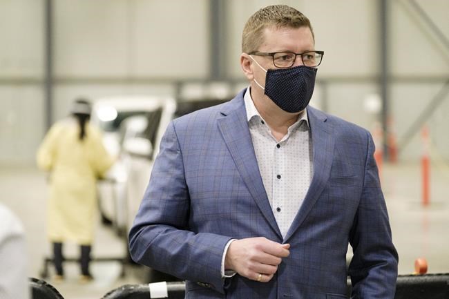 Premier Scott Moe during a tour of the COVID-19 mass immunization clinic and drive-thru immunization space at International Trade Centre in Regina on Thursday, Feb. 18, 2021. THE CANADIAN PRESS/Michael Bell