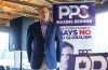 Peoples Party of Canada leader Maxime Bernier waits to speak during a rally held in Vegreville Alta., on September 12, 2021. THE CANADIAN PRESS/Jason Franson