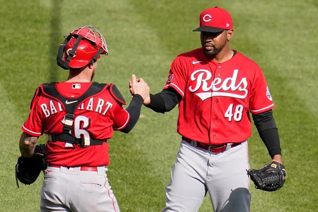 Cincinnati Reds relief pitcher Mychal Givens (48) celebrates with catcher Tucker Barnhart after getting the final out of a baseball game against the Pittsburgh Pirates in Pittsburgh, Thursday, Sept. 16, 2021. The Reds won 1-0. (AP Photo/Gene J. Puskar)