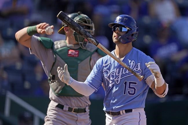 Kansas City Royals' Whit Merrifield flips his bat after striking out during the seventh inning of a baseball game against the Oakland Athletics Thursday, Sept. 16, 2021, in Kansas City, Mo. (AP Photo/Charlie Riedel)