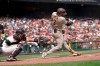 San Diego Padres' Fernando Tatis Jr., right, hits a home run in front of San Francisco Giants catcher Curt Casali during the third inning of a baseball game in San Francisco, Thursday, Sept. 16, 2021. (AP Photo/Jeff Chiu)