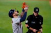 Houston Astros' Carlos Correa celebrates his three-run home run as umpire David Rackley watches Correa cross the plate during the fourth inning of the team's baseball game against the Texas Rangers in Arlington, Texas, Thursday, Sept. 16, 2021. (AP Photo/Tony Gutierrez)