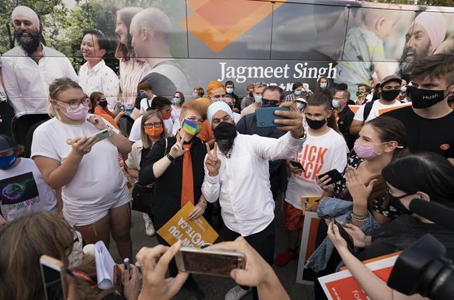 NDP Leader Jagmeet Singh greets supporters during a campaign stop in Hamilton, Ont. Wednesday, September 15, 2021. THE CANADIAN PRESS/Jonathan Hayward