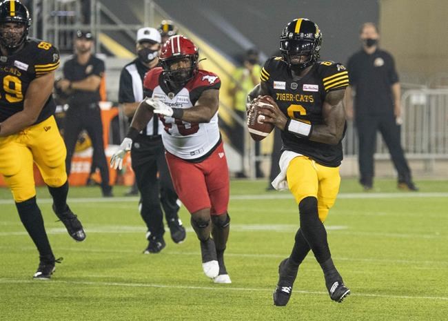 Hamilton Tiger-Cats quarterback David Watford (6) scrambles during first half CFL football game action against the Calgary Stampeders in Hamilton, Ont. on Friday, September 17, 2021. THE CANADIAN PRESS/Peter Power