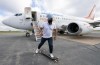 NDP leader Jagmeet Singh long boards on the tarmac in Halifax, N.S., Friday, September 17, 2021. THE CANADIAN PRESS/Jonathan Hayward