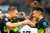 Inter Milan's Edin Dzeko, left, celebrates after scoring his side's 5th goal with his teammate Inter Milan's Lautaro Martinez during a Serie A soccer match between Inter Milan and Bologna, at the San Siro stadium in Milan, Italy, Saturday, Sept. 18, 2021. (AP Photo/Luca Bruno)