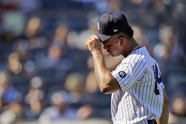 New York Yankees relief pitcher Albert Abreu walks back to the dugout after the close of the fifth inning of a baseball game against the Cleveland Indians, Saturday, Sept. 18, 2021, in New York. (AP Photo/John Minchillo)