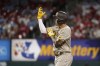 San Diego Padres' Manny Machado celebrates after hitting a double during the sixth inning of a baseball game against the St. Louis Cardinals Friday, Sept. 17, 2021, in St. Louis. (AP Photo/Jeff Roberson)