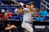 Pittsburgh Pirates' Yoshi Tsutsugo watches a single during the ninth inning of the team's baseball game against the Miami Marlins, Saturday, Sept. 18, 2021, in Miami. The Pirates won 6-3. (AP Photo/Marta Lavandier)