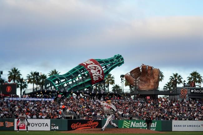 Atlanta Braves' Charlie Morton, bottom, pitches against the San Francisco Giants during the third inning of a baseball game in San Francisco, Saturday, Sept. 18, 2021. (AP Photo/Jeff Chiu)