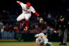 Oakland Athletics' Chad Pinder slides under Los Angeles Angels second baseman David Fletcher for a stolen base during the sixth inning of a baseball game in Anaheim, Calif., Saturday, Sept. 18, 2021. (AP Photo/Alex Gallardo)