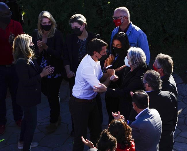 Liberal leader Justin Trudeau greets Liberal candidates as he makes a campaign stop in Montreal, Quebec, on Sunday, Sept. 19, 2021. THE CANADIAN PRESS/Sean Kilpatrick