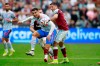 Manchester United's Cristiano Ronaldo, left, goes for the ball as West Ham's Pablo Fornals tries to stop him during the English Premier League soccer match between West Ham United and Manchester United at the London Stadium in London, England, Sunday, Sept. 19, 2021. (AP Photo/Ian Walton)