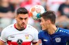 Stuttgart's Konstantinos Mavropanos. left, and Leverkusen's Patrik Schick challenge for the ball during a German Bundesliga soccer match between VfB Stuttgart and Bayer Leverkusen in Stuttgart, Germany, Sunday, Sept.19, 2021. (Tom Weller/dpa via AP)